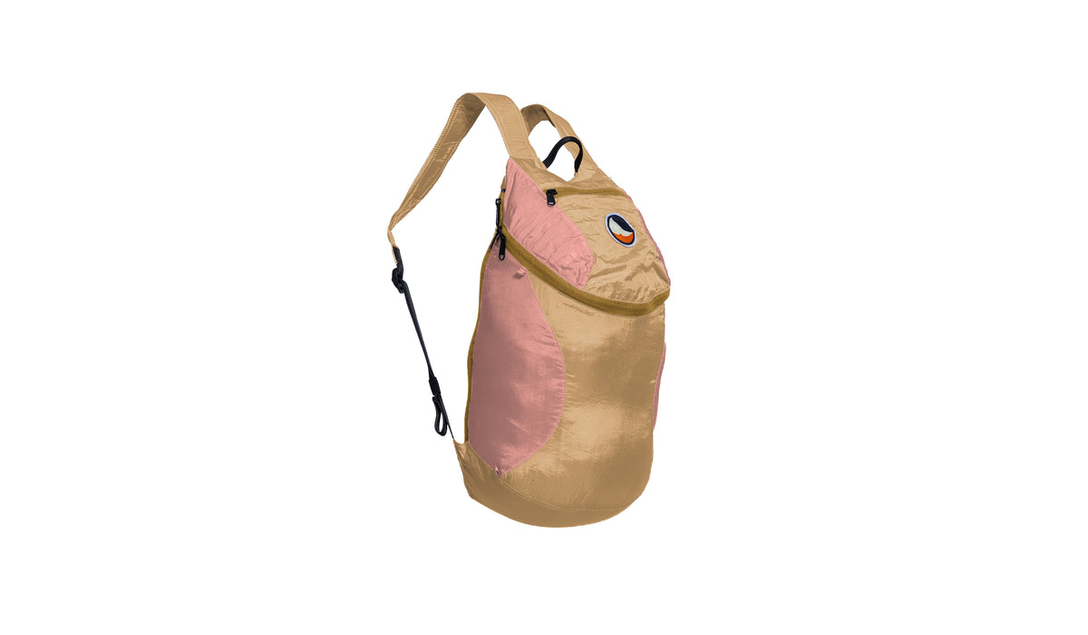 Mini Backpack 15L in Hazelnut and Peach with a sand zip, side view with shoulder strap
