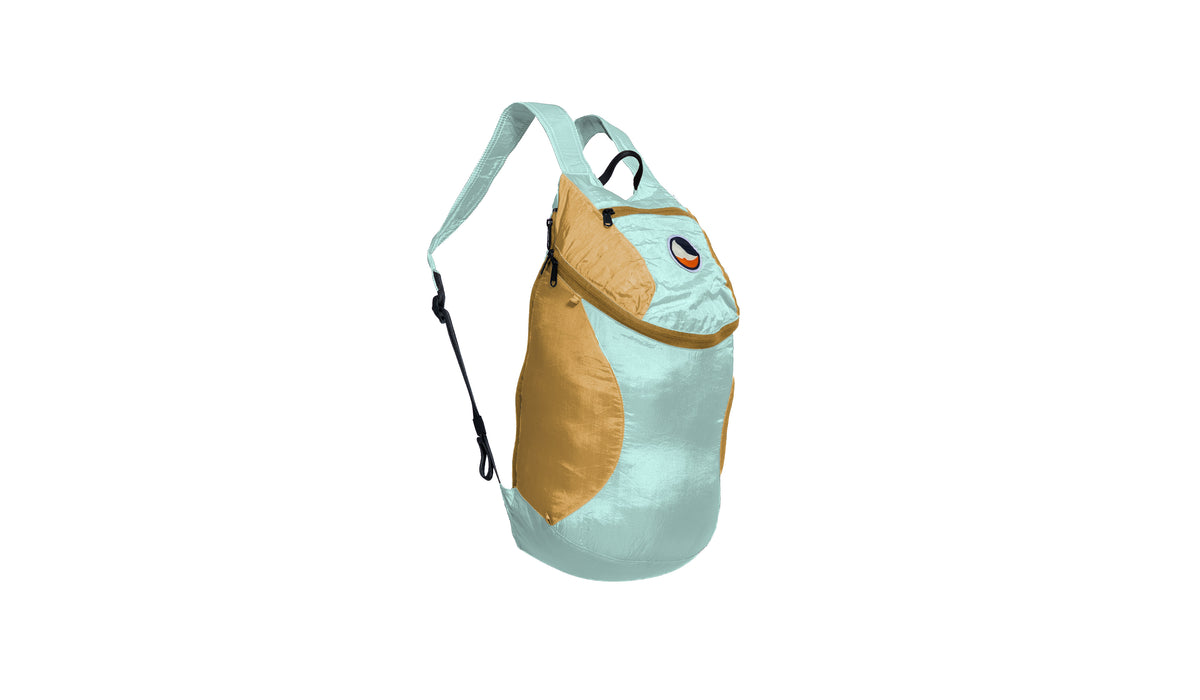 Mini Backpack 15L in Mint and Sand with a sand zip, side view with shoulder strap
