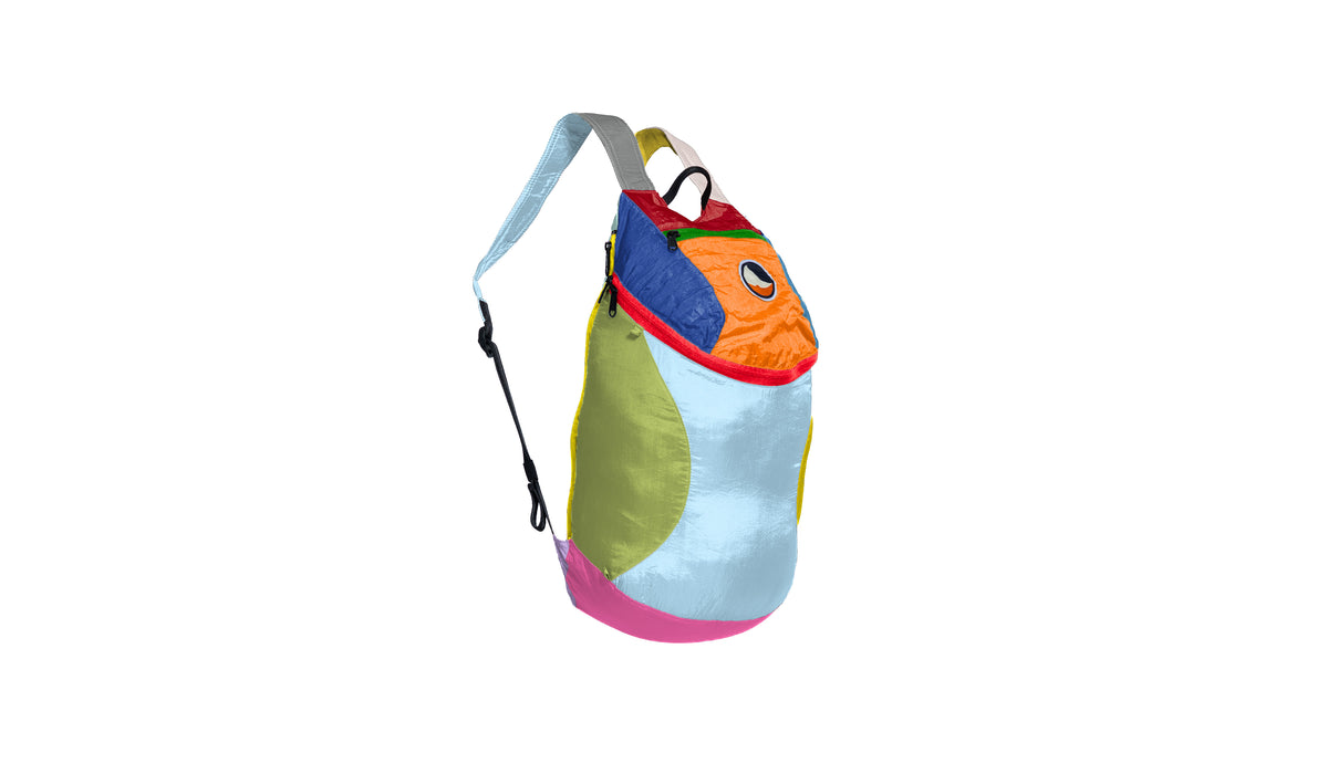 Mini Backpack 15L in Unique multicoloured patchwork, side view with shoulder strap